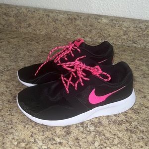 Like new Bright pink, black, and white Nikes. Size 7y